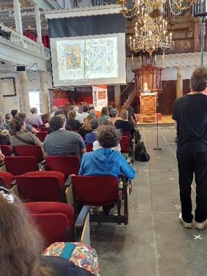 The opening keynote presentation by Kathryn Rudy at the SHARP 2022 conference. The slide shows a spread of a medieval manuscript with a decorative image on the verso and text on the recto. The citation for the spread reads: “Brussels, Royal Library IV 1095, fol. 27v-28r.”