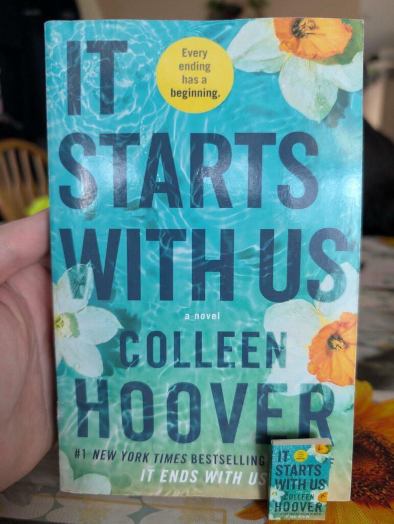 The small, mini version vs. paperback version of It Starts With Us by Colleen Hoover. It’s almost a 1:1 copy