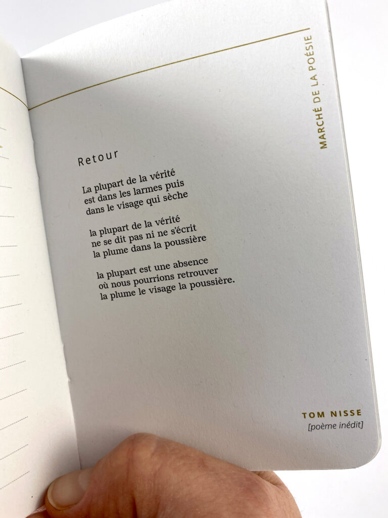 A photograph of an interior page of “Passeport poésie”, featuring the French-language poem “Retour” by Tom Nisse.