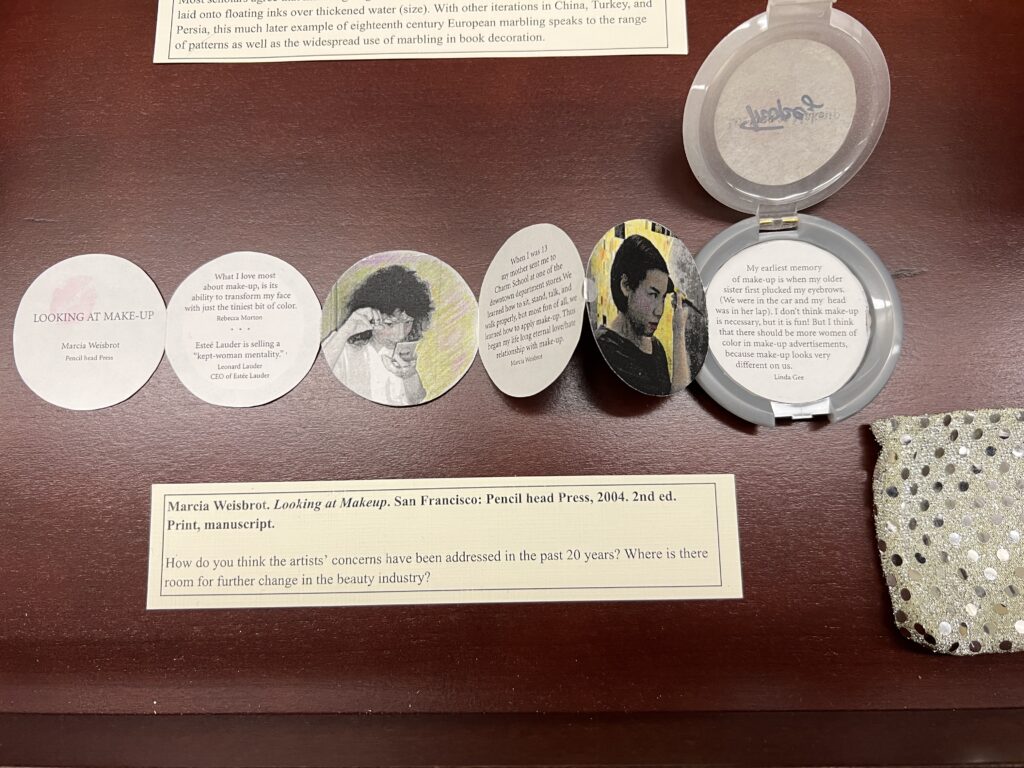 Caption for Marcia Weisbrot’s 2004 artists’ book ‘Looking at Makeup’ reads: "How do you think the artists’ concerns have been addressed in the past 20 years? Where is there room for further change in the beauty industry?”