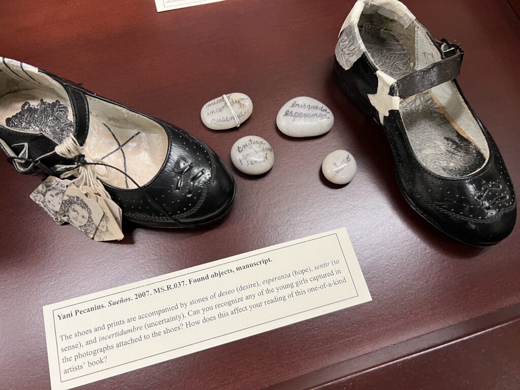 Caption question for Yani Pecanins’ 2007 ‘Sueños’ reads, "Can you recognize any of the young girls captured in the photographs attached to the shoes? How does this affect your reading of this one-of-a kind artists’ book?